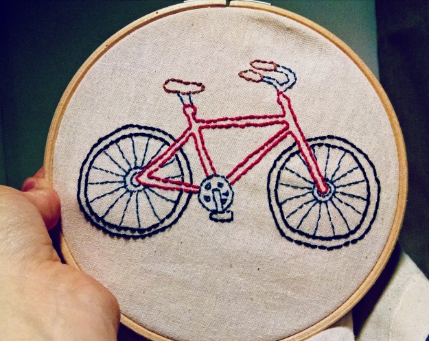 Backstitched embroidered bike in embroidery hoop